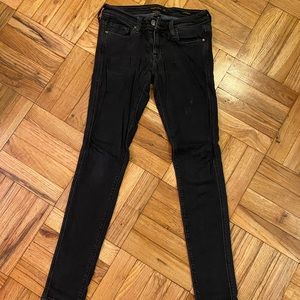Dark blue genetic denim cigarette jean